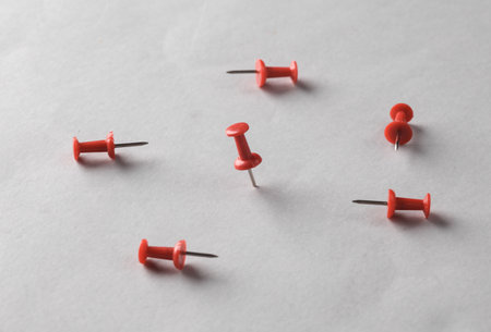 Red pushpins on a gray backgroundの写真素材