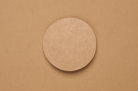 Mockup of round coaster on brown background. Template for designの写真素材