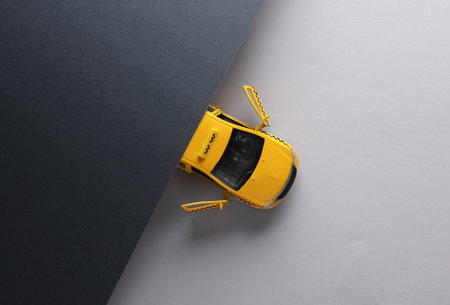 Miniature taxi car on gray background. top view. creative layoutの写真素材