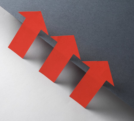 Red pointing arrows on black and gray background. creative layout. minimalist composition. business conceptの写真素材