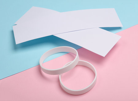 Concert ticket mockup with bracelets on pink blue background. template for design. music fest