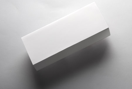 Mockup of a white rectangular box on a gray background. Template for designの写真素材