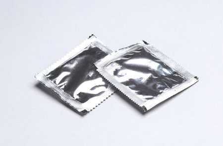 Foil packs with packaged seasoning for cooking on a gray backgroundの写真素材