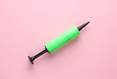 Balloon pump on a pinkj backgroundの写真素材