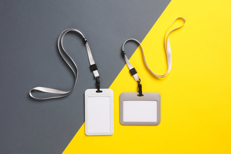 Blank id cards on belt, yellow gray background. template for design. top viewの写真素材