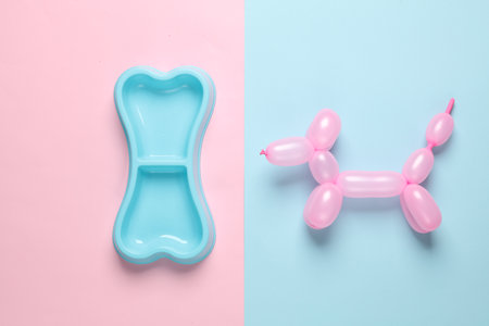 Inflatable balloon dog with a bowl on a blue-pink background. creative layoutの写真素材