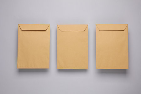 Craft postal envelopes on a gray backgroundの写真素材