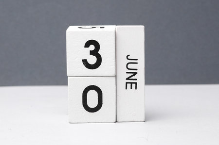 White block calendar with the date June 30 on white-gray background. Deadline, planning, business conceptの写真素材
