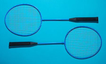 Badbintion rackets on blue bright background