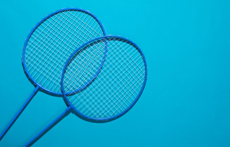 Badbintion rackets on blue bright backgroundの写真素材