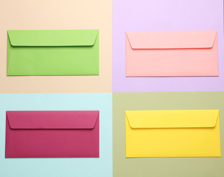 Group of colored envelopes on colored paper. Creative layoutの写真素材