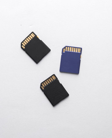 Three sd memory cards on gray backgroundの写真素材