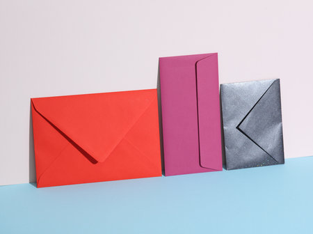 Creative layout with colored envelopes on pastel bright background. Minimalismの写真素材