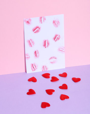 Imprints of lips kisses and hearts on pastel background. Love letter, valentine's day. Creative layoutの写真素材