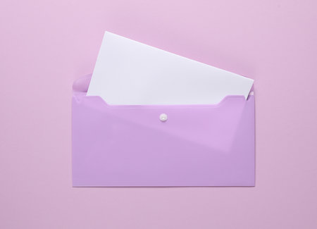 Plastic envelope with a letter on a purple background