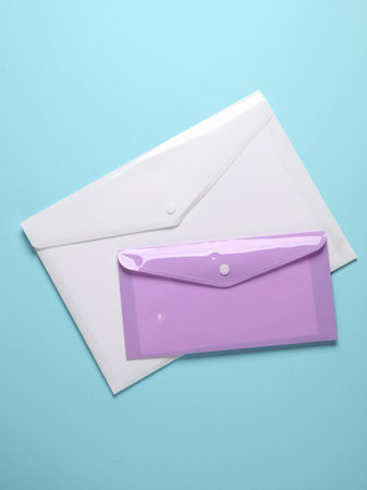 Plastic envelopes on a blue backgroundの写真素材