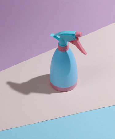 Blue-pink plastic spray bottle on a pastel background. Minimalismの写真素材
