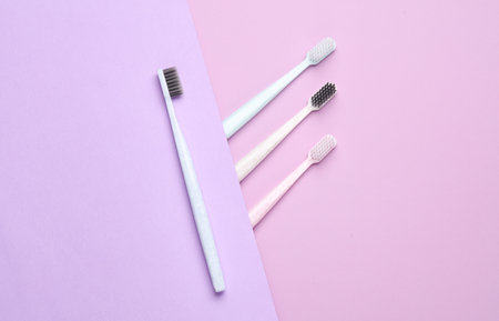 Plastic toothbrushes on a pastel background. Creative layout, Minimalism