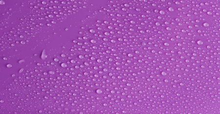 Water drops on purple background. Surface for designの写真素材