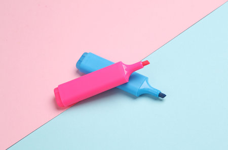 Blue and pink marker on pink blue backgroundの写真素材