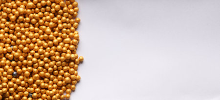 Bronze make up powder balls on white background. Copy space. Beauty concept