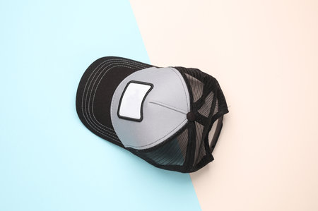 Baseball cap mockup with white empty  on pastel background. Top view