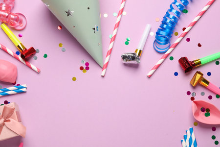 Festive birthday accessories with copy space on a pink background.の写真素材
