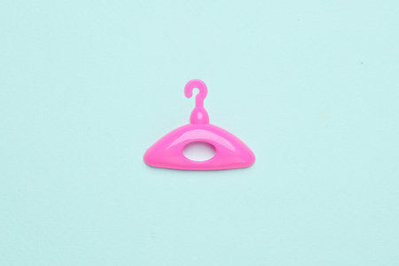 Doll hanger on blue background. Minimalism fashion conceptの写真素材