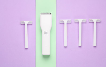 Clipper and razors on pastel background. Minimalism beauty conceptの写真素材