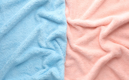 Crumpled pink and blue fleecy fabric closeup textureの写真素材
