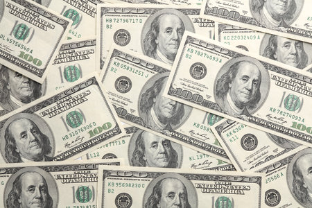 Lots of hundred dollar bills close up
