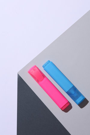 Markers on the corner of gray cube. Optical geometric illusion. Creative layout. Minimalismの写真素材