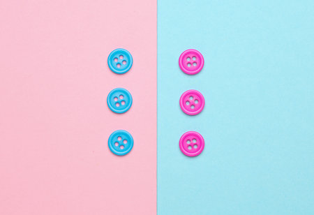 Plastic pink and blue buttons on a blue pink backgroundの写真素材