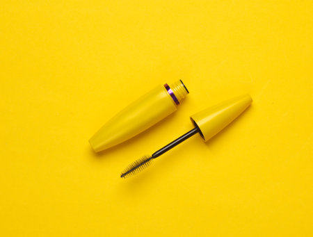 Mascara brush on a yellow background. Beauty conceptの写真素材