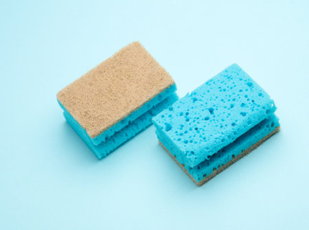 Two cleaning sponges on blue backgroundの写真素材