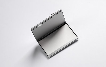 Metal box business card holder with business cards on white backgroundの写真素材