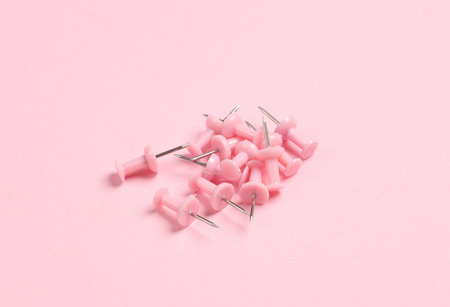 Pink Stationery pins on pink pastel background.