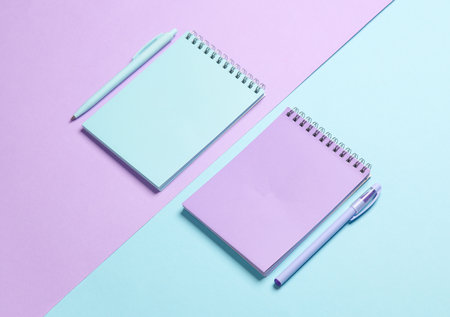 Two notebooks with a pen on pastel background. Minimalism. Creative layoutの写真素材