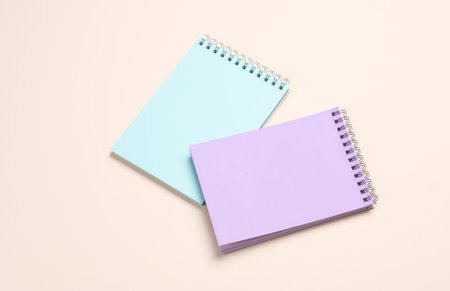 Two notebooks on beige pastel background. Minimalism. Creative layoutの写真素材
