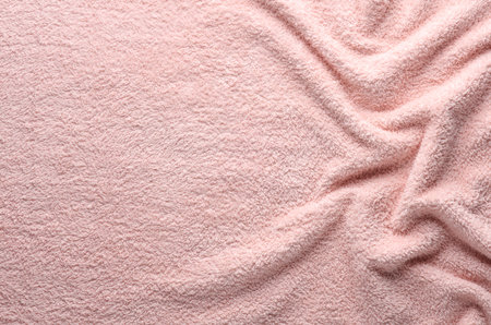 Texture of wavy pink fleecy towel with copy spaceの写真素材