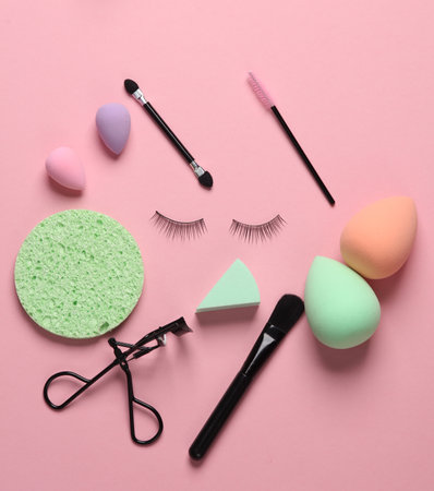 Set of beauty products, make-up accessories on a pink background. Flat layの写真素材
