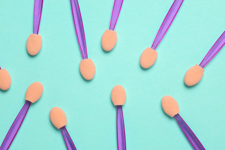 Set of applicators for makeup on mint green backgroundの写真素材