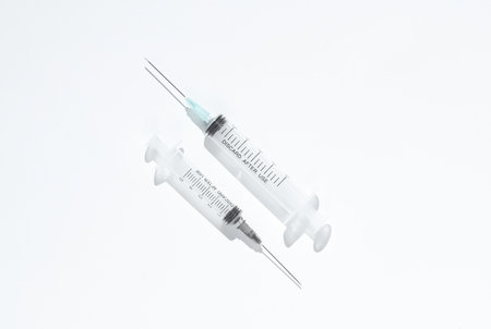 Syringes on a white background with shadow