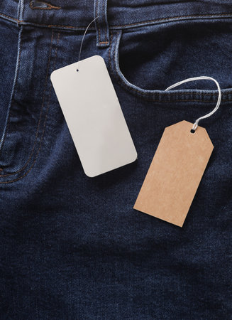 Blue jeans with price tags close up. Mockupの写真素材