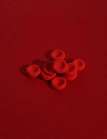 Red blood cells model on red background