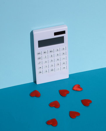 Hearts with calculator on blue backgroundの写真素材