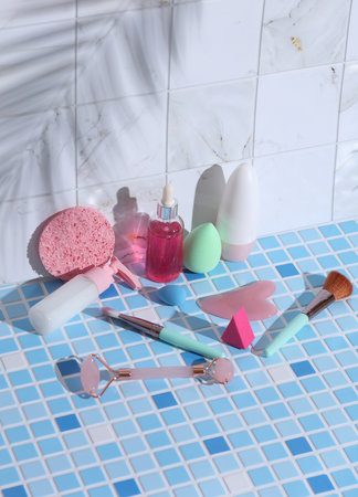 Beauty products on tile with palm leaf shadow. Creative layout. Beauty still life