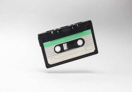 Retro audio cassette levitating on white background. Minimalismの写真素材