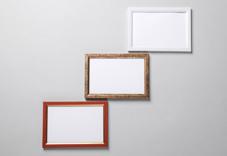 Blank wall frames on a gray background
