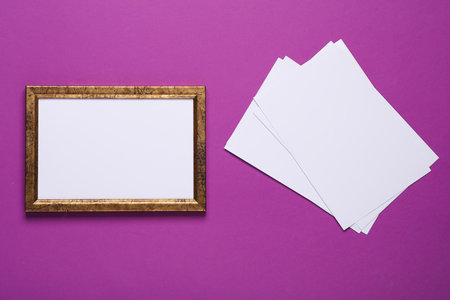 Frame with empty white sheets of photos on a purple backgroundの写真素材